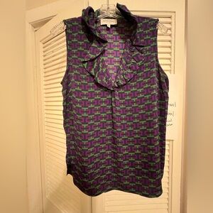 Sleeveless silk top with ruffle collar